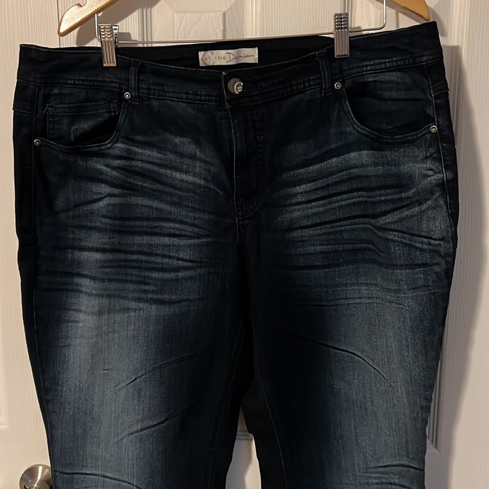 Dark blue faded jeans.